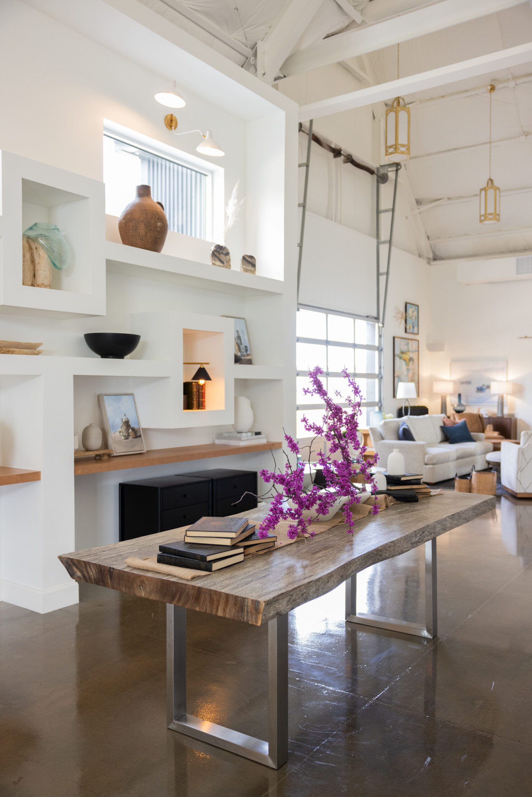 The corridor of the Studio at K|D, with vaulted ceilings and custom shelving.